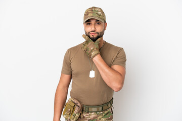 Young arab soldier man isolated on white background thinking