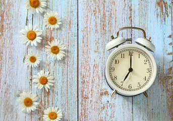 vintage alarm clock and flowers