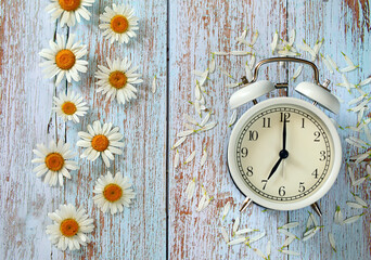 vintage clock on wooden background