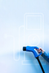 Electric car charging station. Power cable pump plug in recharge fuel technology with cable to...
