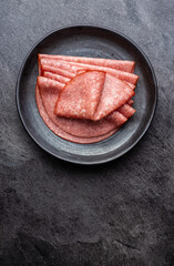Sliced smoked salami on plate