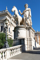 Fototapeta na wymiar Capitoline Hill on Piazza del Campidoglio designed by Michelangelo, ancient sculpture at Michelangelo Capitoline Steps, Rome, Italy