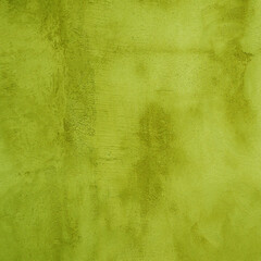 Designer background from old shabby yellow-green plaster.
