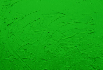 Picture of a wall painted with green paint.