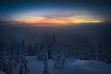 Winter foggy sunset in National park Koli