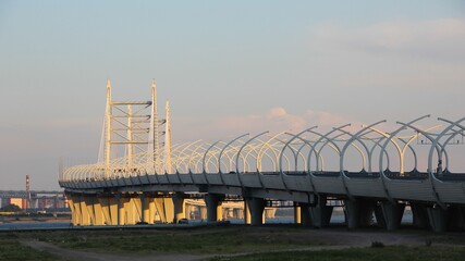 cable bridge and autobahn over the bay at sunset