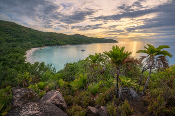 sunset at tropical beach anse lazio on praslin on the seychelles