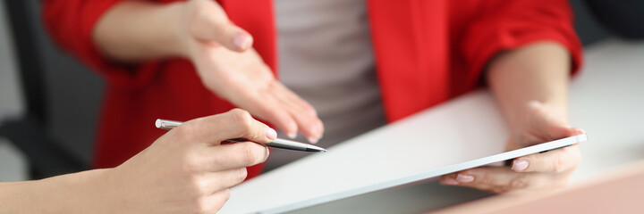 Partners discuss working moments on tablet closeup