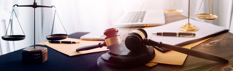 Business and lawyers discussing contract papers with brass scale on desk in office. Law, legal...