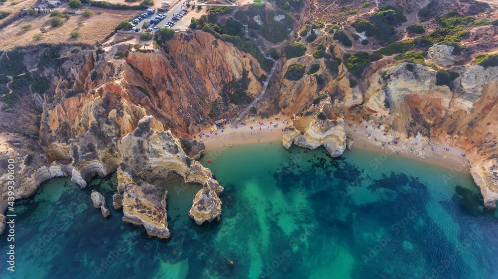 Wall mural Camilo Beach in Lagos, Algarve - Portugal. Portuguese southern golden coast cliffs. Sunny day aerial view.