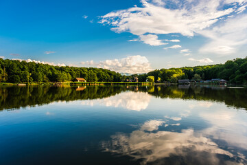 clouds in the blue sky reflecting in the lake