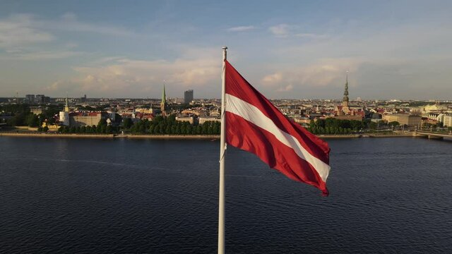 Panorama of Riga city with a big Latvian flag in foreground