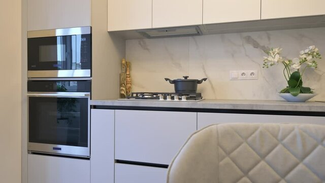 White moden classic kitchen with dining table