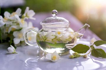 Tea with chasmina flowers in the summer garden.