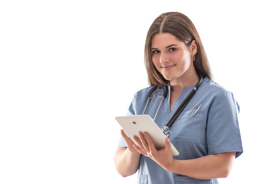 isolated photo of a young nurse in the hospital doing stuff on tablet with stethoscope hanging on her neck