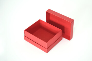 Mini gift box made of designer paper on a white background with an open lid