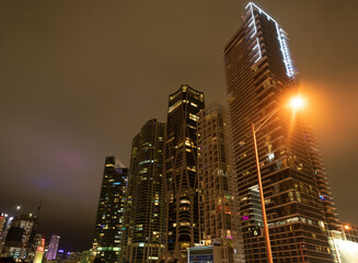 Towerblocks lit up in night city of Miami, USA