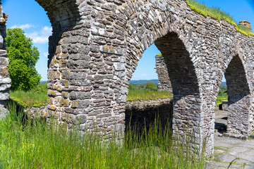 Fototapeta na wymiar Gudhem Historical Monastery Ruin and Church in rural environment with overgrown stone walls and arches during Summer near Falkoping Vastra Gotaland, Sweden.