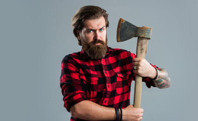 handsome bearded guy with beard and moustache hold ax, woodsman