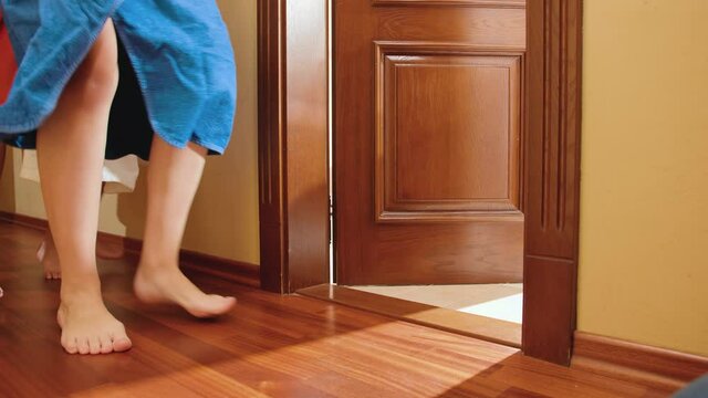 Family members running towards free toilet or bathroom in house at morning. Concept of family living in big house or on vacation