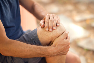 Man with knee pain outdoor. Healthcare and medicine concept