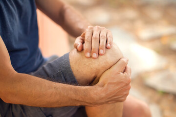 Fototapeta premium Man with knee pain outdoor. Healthcare and medicine concept