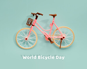 World Bicycle Day on June 3. Toy model town bike with shadow on mint blue background. Flat lay, top view, minimal retro vintage concept design.