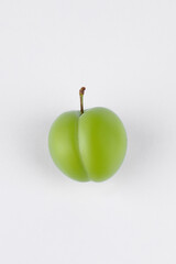 fresh and green plum on white background