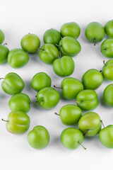 fresh and green plum on white background