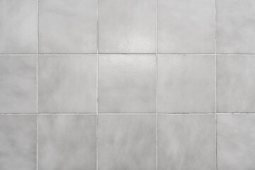 Glossy gray tiled wall. Texture wallpaper background.