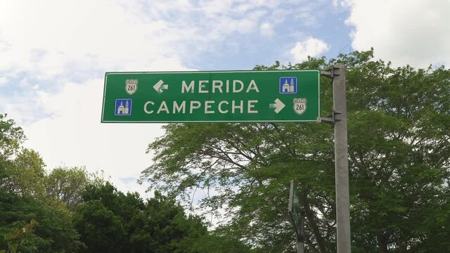 Directional signpost showing directions to the Merida and Campeche cities in Mexico