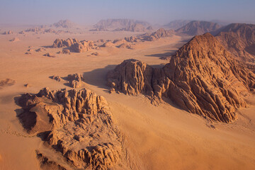 The view of rock formations in Wadi Rum desert from a hot air balloon at sunrise, Jordan, April 2018