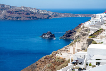 Naklejka na ściany i meble Oia, small village in Santorini, cyclades, Aegean Sea, islands of Greece, a well known travel destination