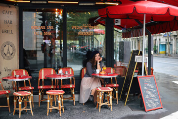 Beautiful girl walking in romantic paris
