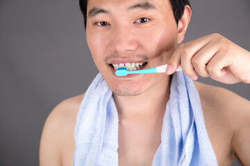 Man brushing his teeth in the morning