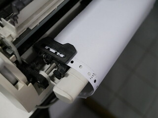 Fototapeta premium closeup of continuous paper printer in the office.