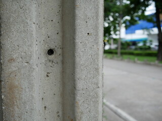 closeup of electric concrete pole.
