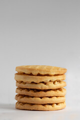 A pile of waffles isolated on gray background.
