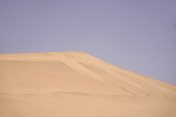 Fototapeta na wymiar desert dune silhouette with sky background