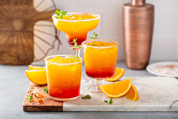 Tequila sunrise margarita cocktail with ice, refreshing drink - obrazy, fototapety, plakaty