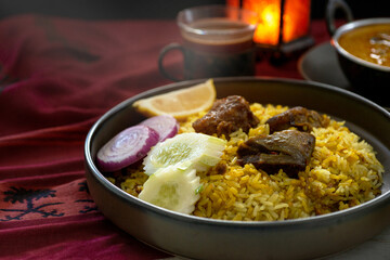 Beef Biryani, traditional spicy Muslim food, yellow rice cooked with aromatic spices with beef, selective focus