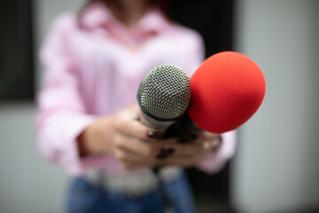 Today TOP story! Journalist at news conference, writing notes, holding microphones