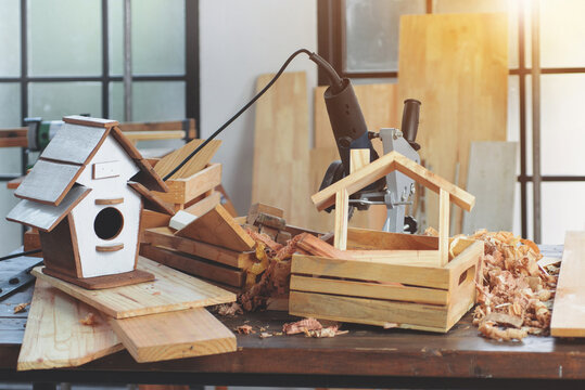 Woodworking and hand tools on the table in the workshop, DIY wood work, wooden plank in background, concept of DIY