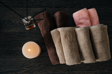 SPA-center. Towels, aromatic oil and candles in the massage parlor. View from above
