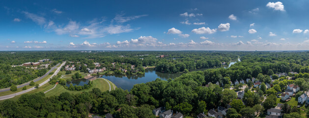 Aerial panorama of single family homes and town house neighborhoods around Lake Elkhorn, a manmade...