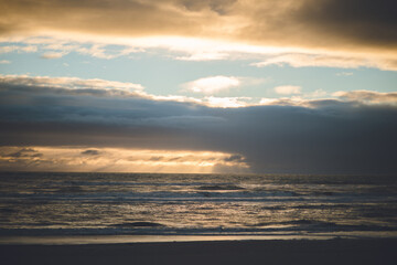 Fototapeta na wymiar Sunset on Karamea Beach, West Coast, New Zealand