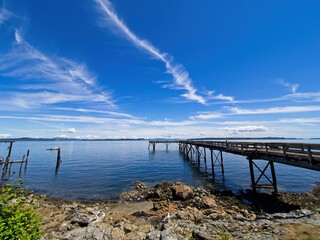 Spectacular clouds over Sidney BC shoreline, seaside boardwalk