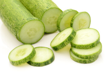 closeup sliced green ripe cucumber isolated on white background.