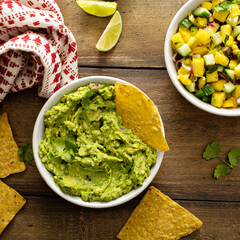 Tortilla chips with dips, guacamole and salsa