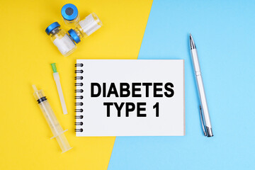 A syringe, ampoules and a notebook with the inscription - DIABETES TYPE 1